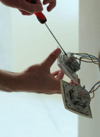 professional electrician working on a home electrical system close up man installing a sbi 351478733